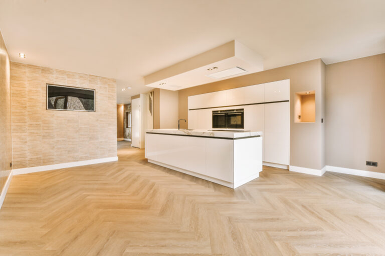 A minimalist kitchen with a block system in white design in a modern, cozy house